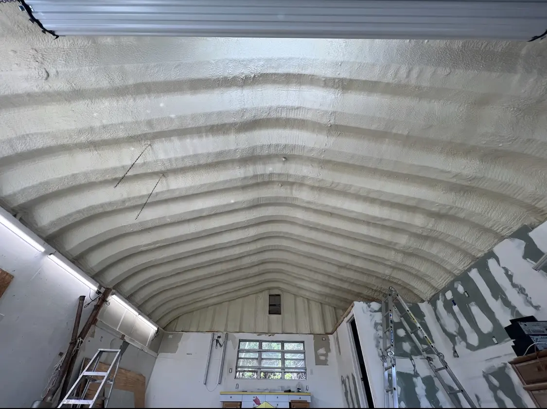 Spray polyurethane foam applied to the underside of a metal roof deck in Leominster